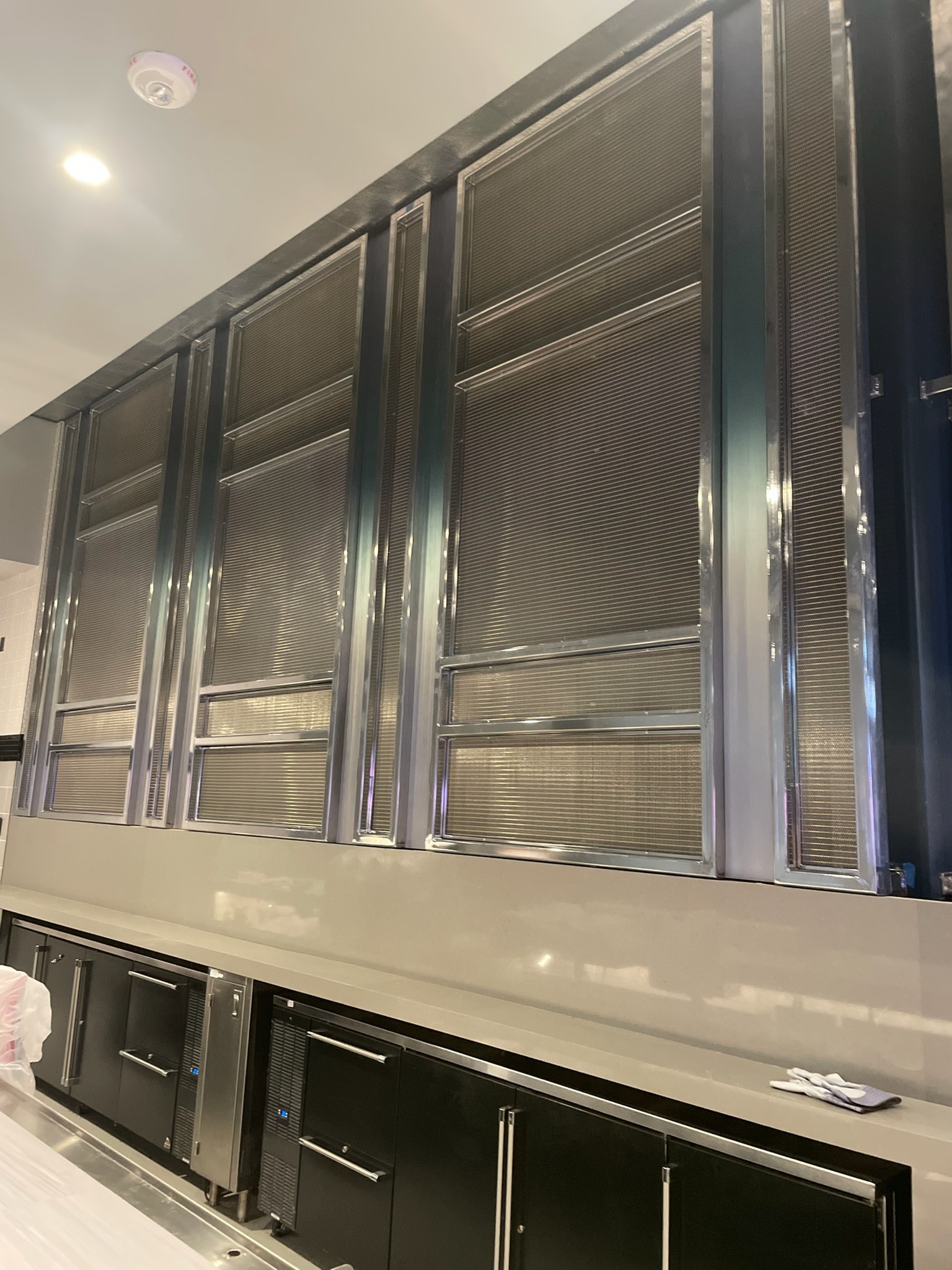 Stainless steel panels and custom metalwork in a commercial kitchen