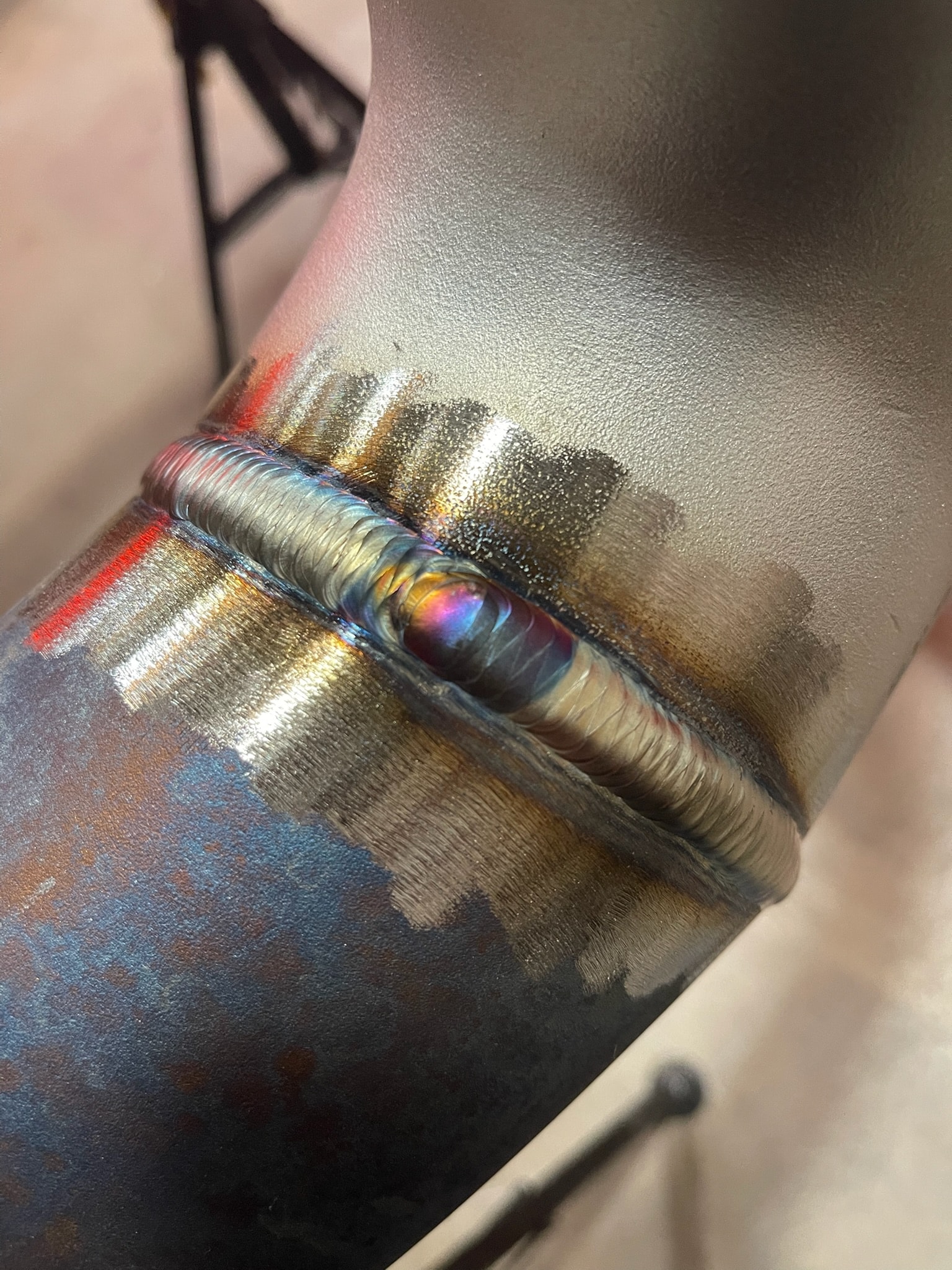 Close-up of a precision welded steel joint with clean bead detail
