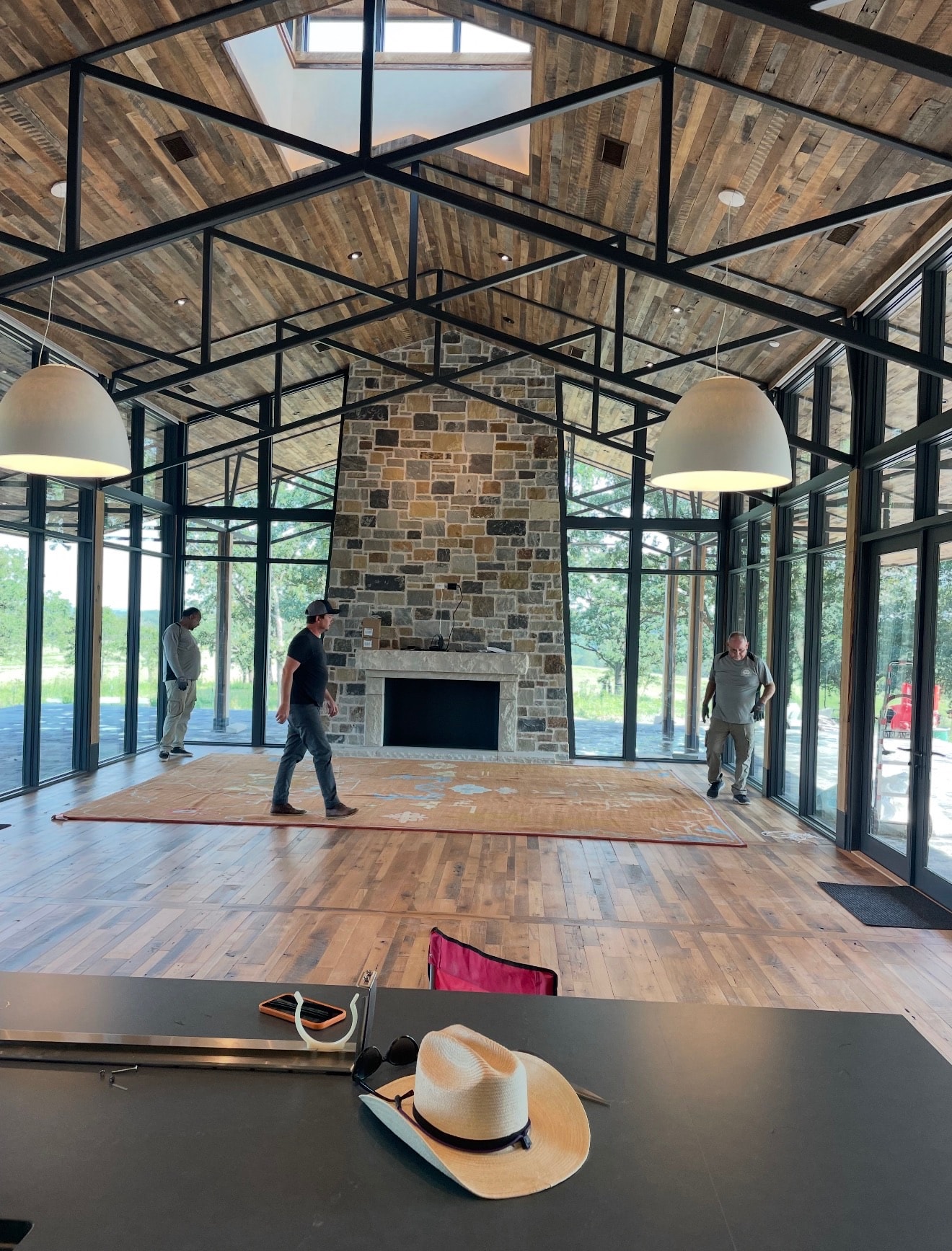 Custom black steel trusses framing a residential great room