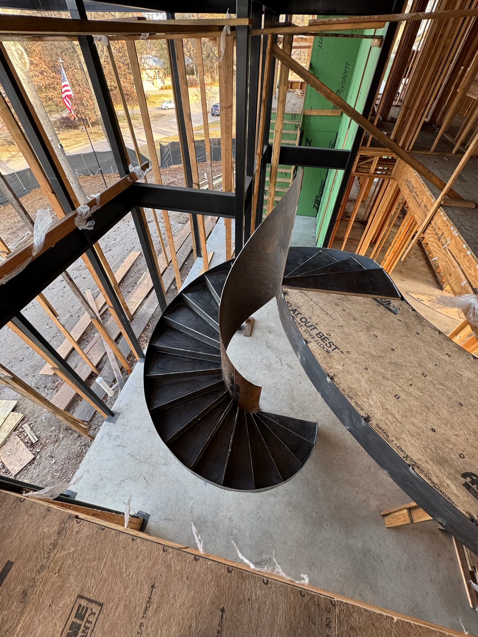 Overhead view of a custom steel spiral staircase in a residential build