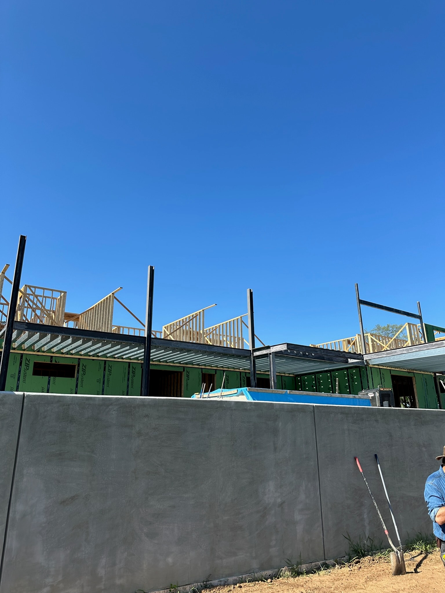 Structural steel deck frame integrated with a residential build