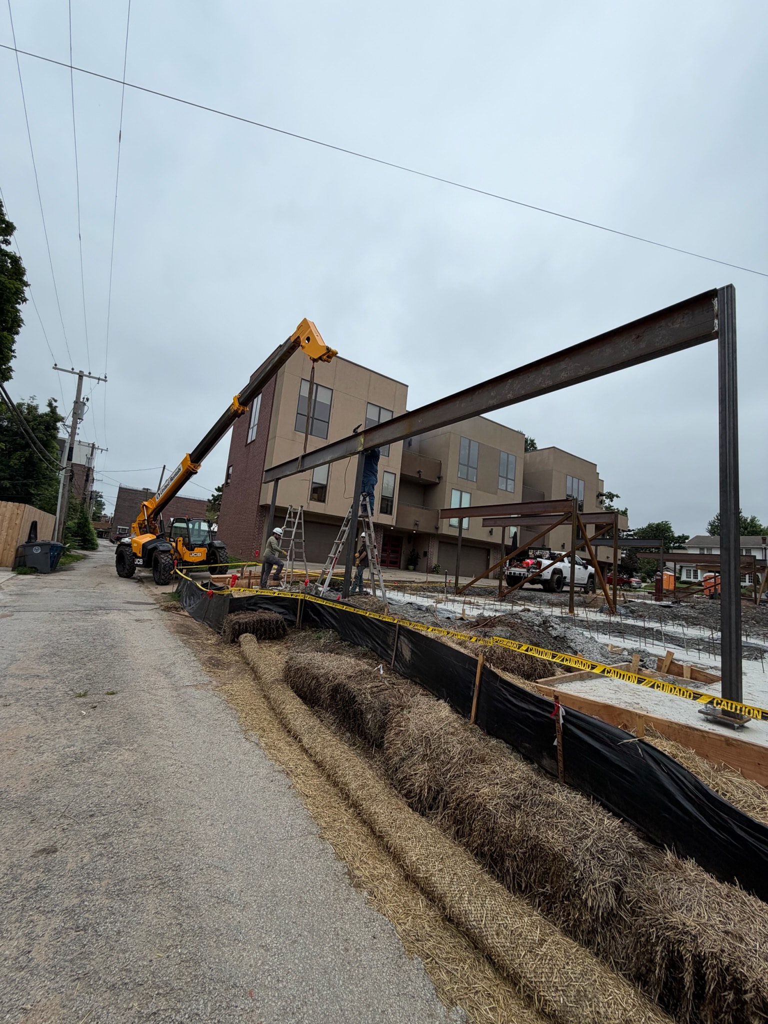 Structural steel installation underway at an urban construction site